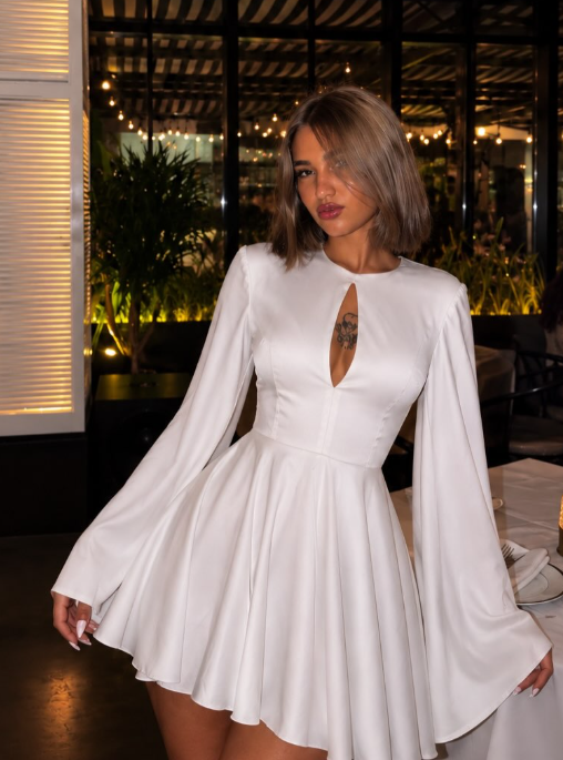 Gomana, founder of Katie Look, in a cream tailored suit